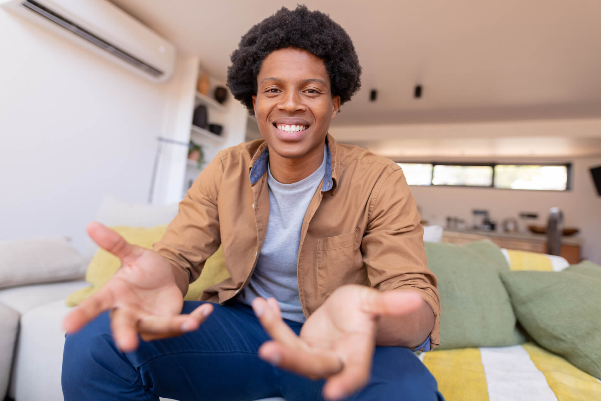 portrait-of-happy-african-american-young-man-gestu-2022-02-18-18-21-20-utc.jpg